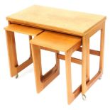A McIntosh of Kirkcaldy teak nest of three tables, the larger tea table with a rectangular hinged fo