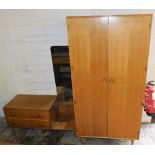 A 1950's Meredew oak wardrobe, of plain form, with turned wooden handles, on square tapering legs, 1