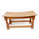 A Robert Thompson Mouseman oak double dish topped stool, on octagonal supports with carved mouse to