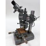 A Leitz model number 2459 electric engineer's microscope.