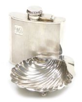 An Edwardian VII silver butter dish, of scallop shell form, raised on three ball feet, Chester 1906,