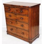 A Victorian mahogany chest of drawers, the top with rounded corners above two short over three long