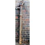 A cast metal water pump, 161cm high.