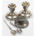 A group of small silver, comprising a pair of Elizabeth II silver squat candlesticks, Birmingham 197