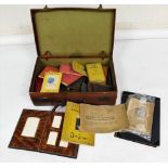 An early 20thC suitcase, containing various books, antiquarian binds, Euclid, Fougasse, photograph a
