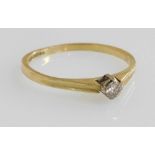 An 18ct gold and diamond solitaire ring, high claw set, approximately &#8539? carat, size K, 1.4g.
