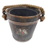 A Victorian wooden fire bucket, with a rope handle, copper banding and painted royal coat of arms, 3