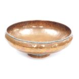 A Hugh Wallis hammered copper bowl, the centre with incised central flower and diamond decoration, w