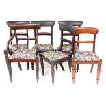 A harlequin set of early 19thC mahogany dining chairs, each with a bar back and a drop in seat, on t