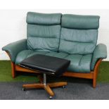 A Stressless oak framed two seater sofa, with green leather upholstery, 159cm wide, and a mid centur