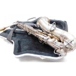 A Frank Holton silver plated saxophone, with mother of pearl touch pieces, model number 22955, with