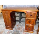 A Victorian mahogany kneehole desk, made up, the rectangular top with a moulded edge above an arrang