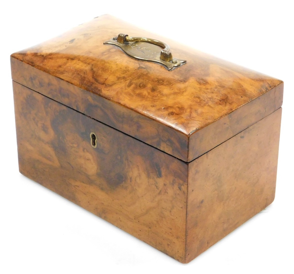 A 19thC burr walnut tea caddy, of rectangular form with a cushion shaped top, with a brass handle wi