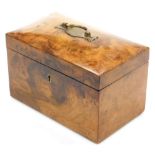 A 19thC burr walnut tea caddy, of rectangular form with a cushion shaped top, with a brass handle wi