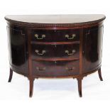 An Edwardian mahogany demi lune side cabinet, the top with a gadrooned edge, with three central draw