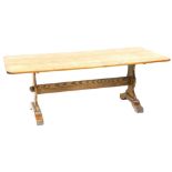 A 20thC oak refectory type table, on trestle end supports united by a stretcher, 74cm high, the top