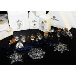 A group of Swarovski crystal, to include three Christmas ornaments for 2001, 1998 and 1999, an angel