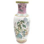 A Chinese porcelain vase, decorated in coloured enamels with buildings, trees, mountains, etc., with