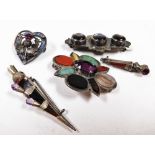 A Scottish silver and agate dirk kilt brooch, another similar, a heart shaped brooch set with agates