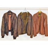 A brown leather flying type jacket, and two other leather jackets, labels for Top Grade Hyde Park. (