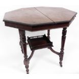 A Victorian mahogany octagonal window table, the top with a moulded edge on a turned legs, supportin