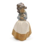 A Lladro matte porcelain figure of Tenderness, printed and impressed marks, 22cm high.
