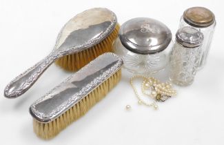 A group of dressing table items, comprising a George V silver mounted hairbrush and clothes brush, w