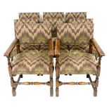 A set of eight Carolean style oak dining chairs, with upholstered backs and overstuffed seats, raise