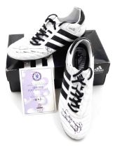 A pair of black and white Adidas football boots signed by Frank Lampard, signed in black pen to each