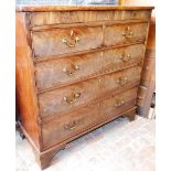 A George III mahogany chest of drawers, with a secret frieze drawer above two short over three long
