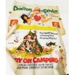 Two original period film posters for Carry on Camping and Dr in Clover.