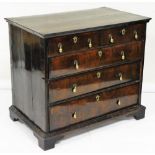 A William & Mary walnut chest of drawers, the crossbanded and feather banded top with a moulded edge