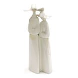 A Lladro porcelain figure group of two nuns, printed and impressed marks, 33cm high, (AF).