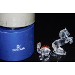 Two items of Swarovski crystal, comprising a rearing horse, A7612, 11cm high, and a dinosaur, A7550,