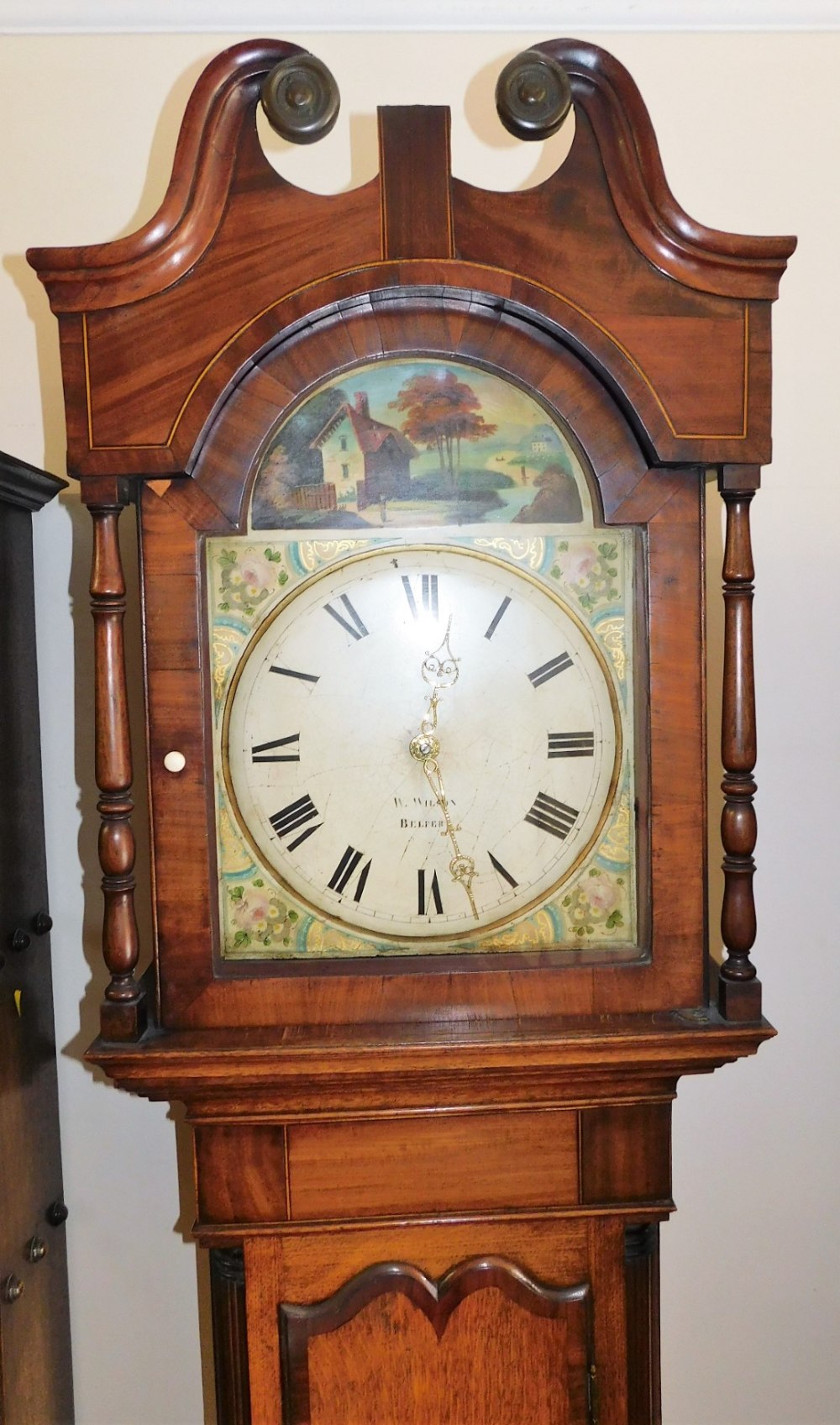 W. Wilson Belper. A 19thC oak longcase clock, the arched dial painted with a river landscape with c