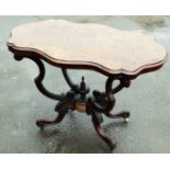 A Victorian burr walnut centre table, the shaped top with a moulded edge on four scroll shaped and c