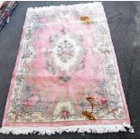 A Chinese wool pink ground rug, floral decorated in the Aubusson style, 300cm x 185cm.