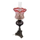 A late 19th/early 20thC Messengers Duplex no. 2 oil lamp, with a floral etched cranberry glass shade