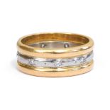 A diamond set triple wedding band, grain set in white and yellow metal, stamped platinum, size K/L,