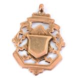 A 9ct gold commemorative pendant medallion, with vacant shield reserve, 7.6g.