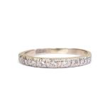 A diamond half hoop eternity ring, set with ten diamonds in white metal, indistinctly hallmarked, si