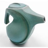 A studio pottery jug, of abstract form, matte turquoise glaze, impressed potters seal mark to unders