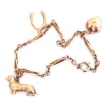 A 9ct gold charm bracelet, with three charms, as fitted, on a bolt ring clasp, 4.9g.