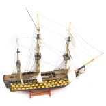 A wooden model of a galleon, over three tiers, with three masts, on turned base, 80cm high, 85cm wid