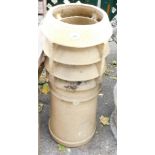 A Victorian chimney pot, with four tiered turreted top, 84cm high, 25cm diameter.