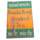 A Brooke Bond Tea enamel sign, the Brooke Bond Dividend Tea, Spend Wisely, on an orange and green en