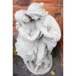A reconstituted stone figure group of lady and gentleman in embrace, 72cm high.
