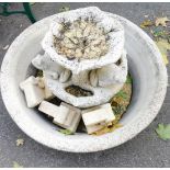 A reconstituted stone water fountain, with large oval base on two mounted tiers, with frogs, 60cm hi