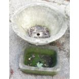 Two reconstituted stone planters, comprising a circular planter, 60cm high, and a rectangular stone