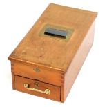 A mahogany and brass cash register, 19cm high, 25cm wide, 48cm deep.